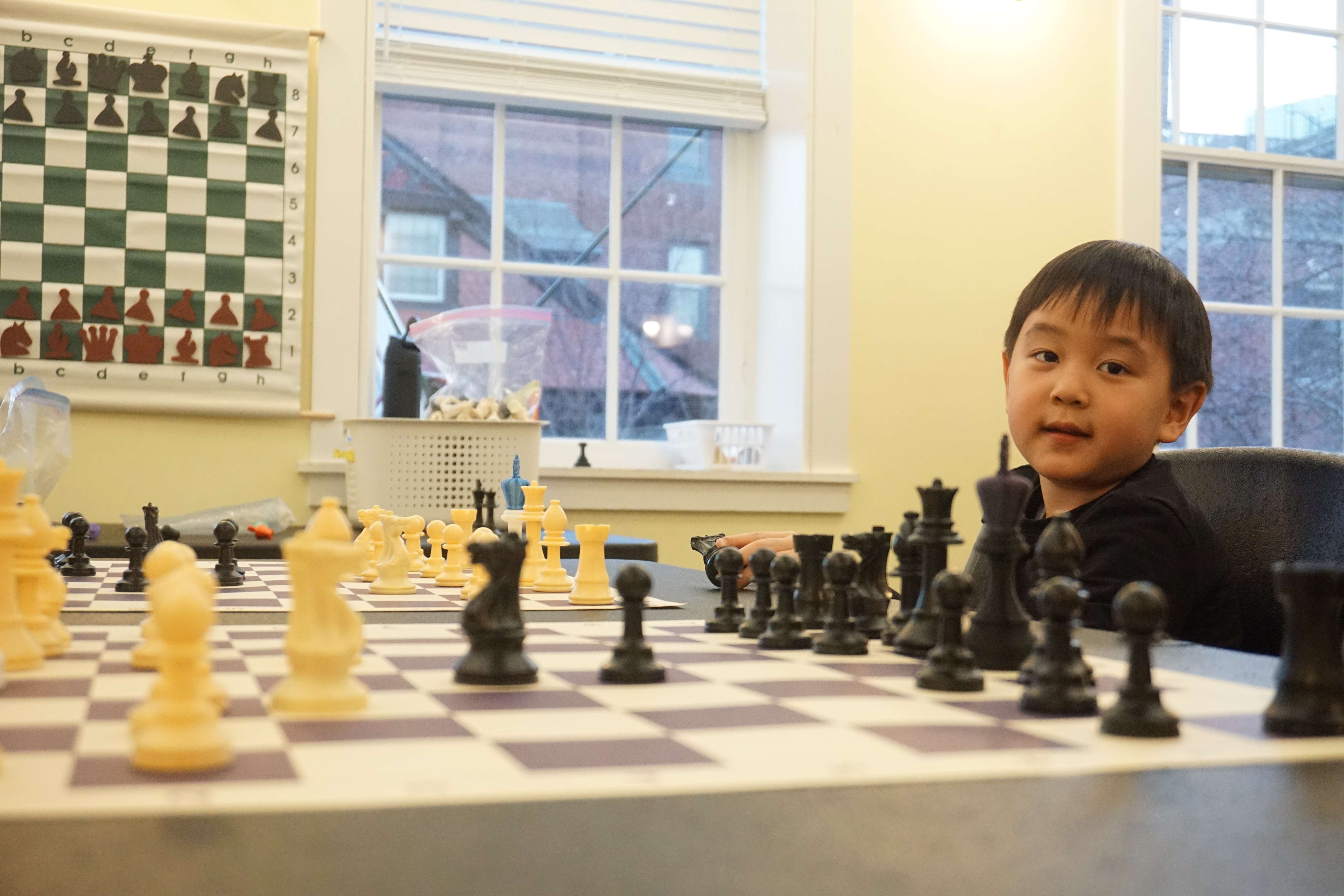 Boys playing chesst